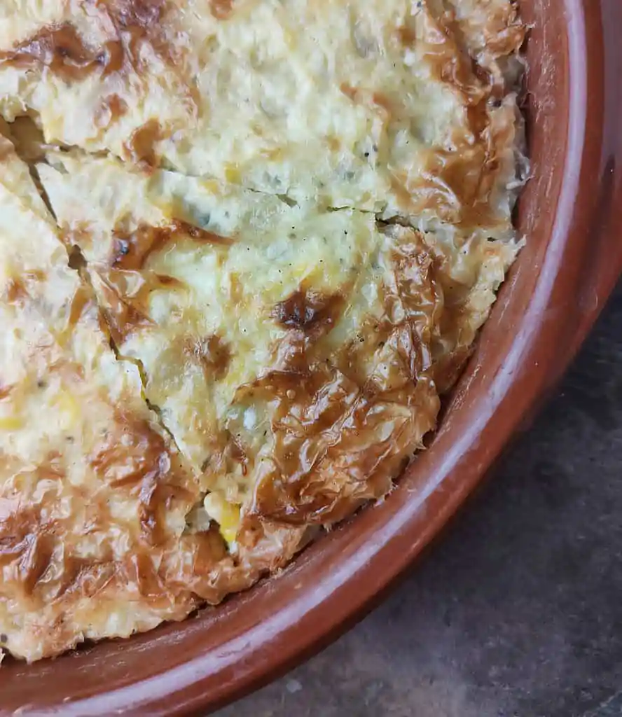 image showing how to slice a hot baked phyllo cabbage pie
