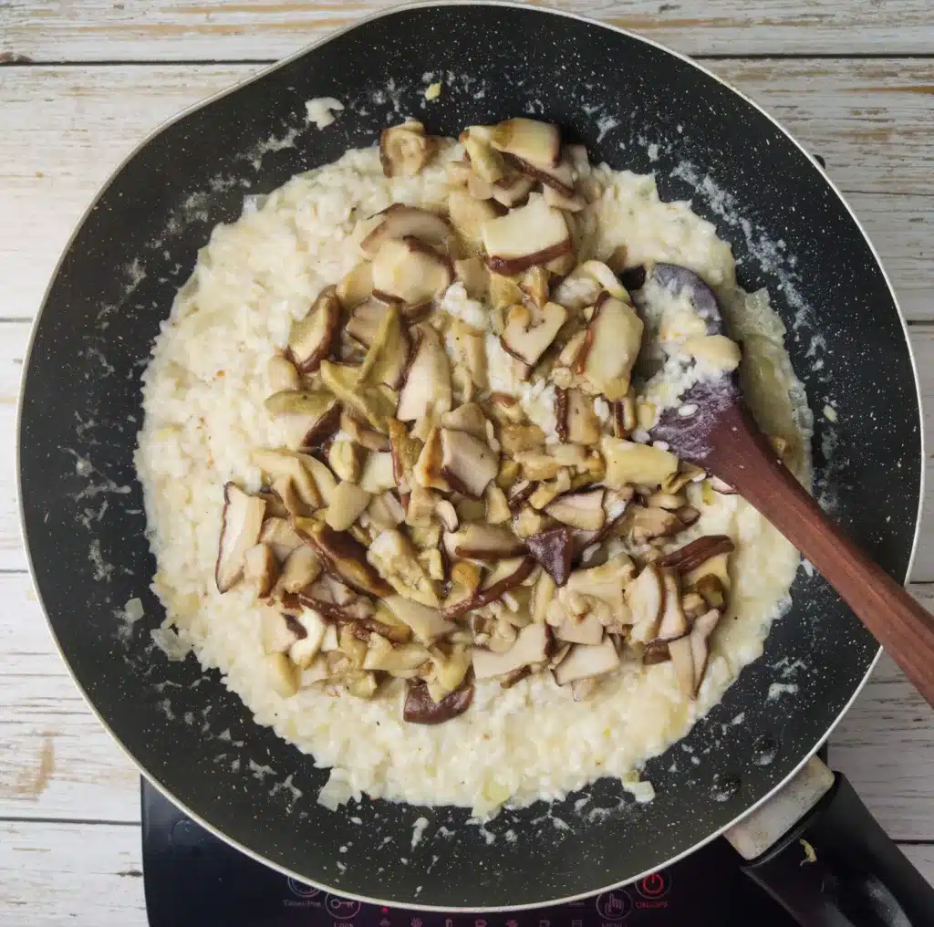 adding porcini to the rice