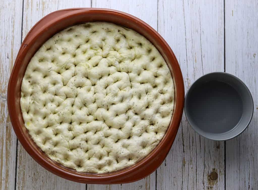 black pepper focaccia dough before baking