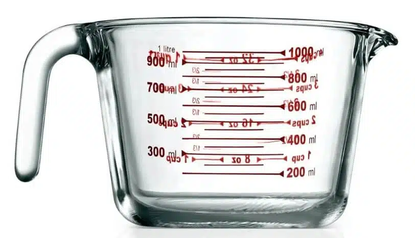 image showing a measuring cup that is labeled both with cups and ml 