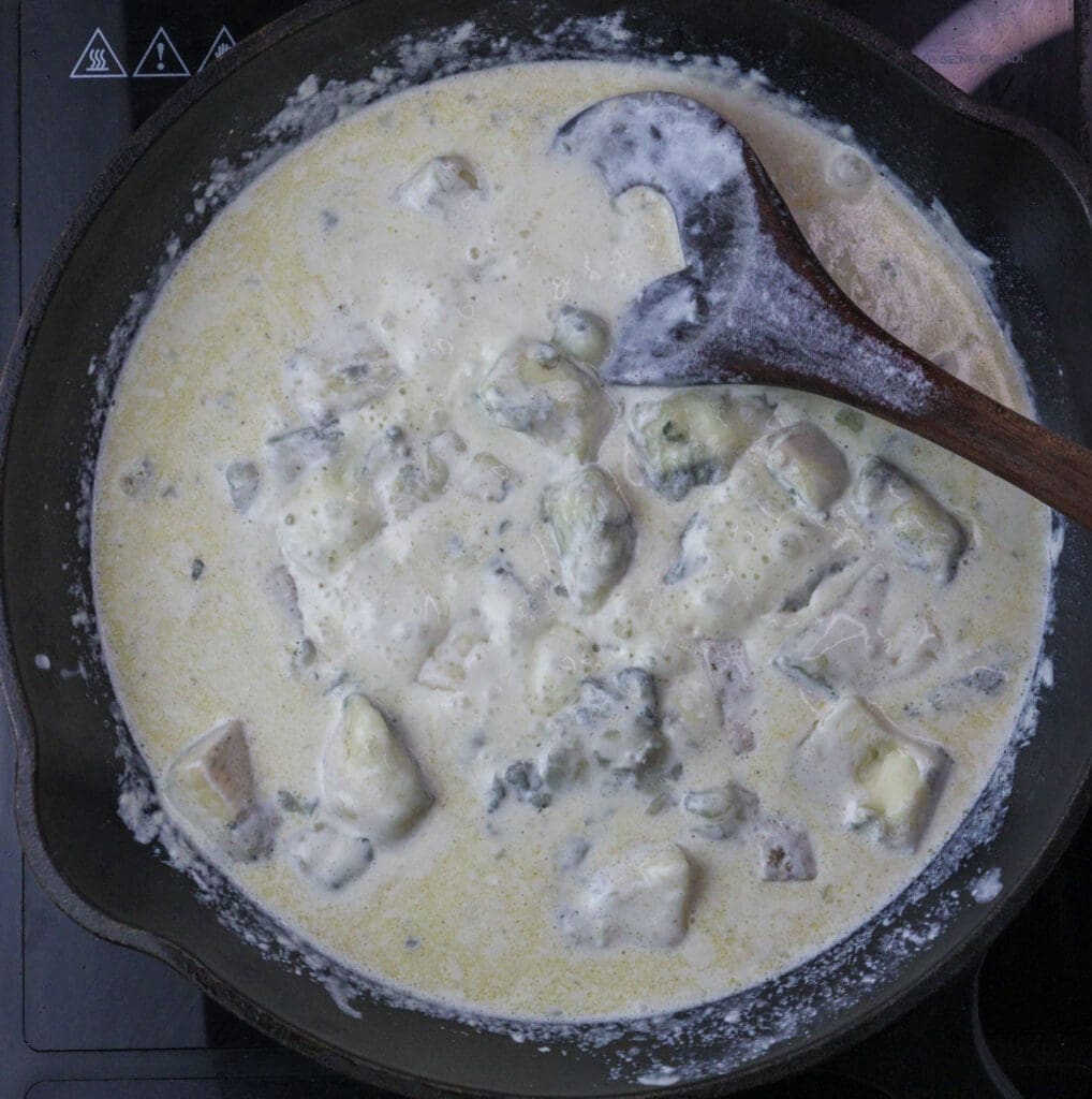 adding gorgonzola to the sauce 