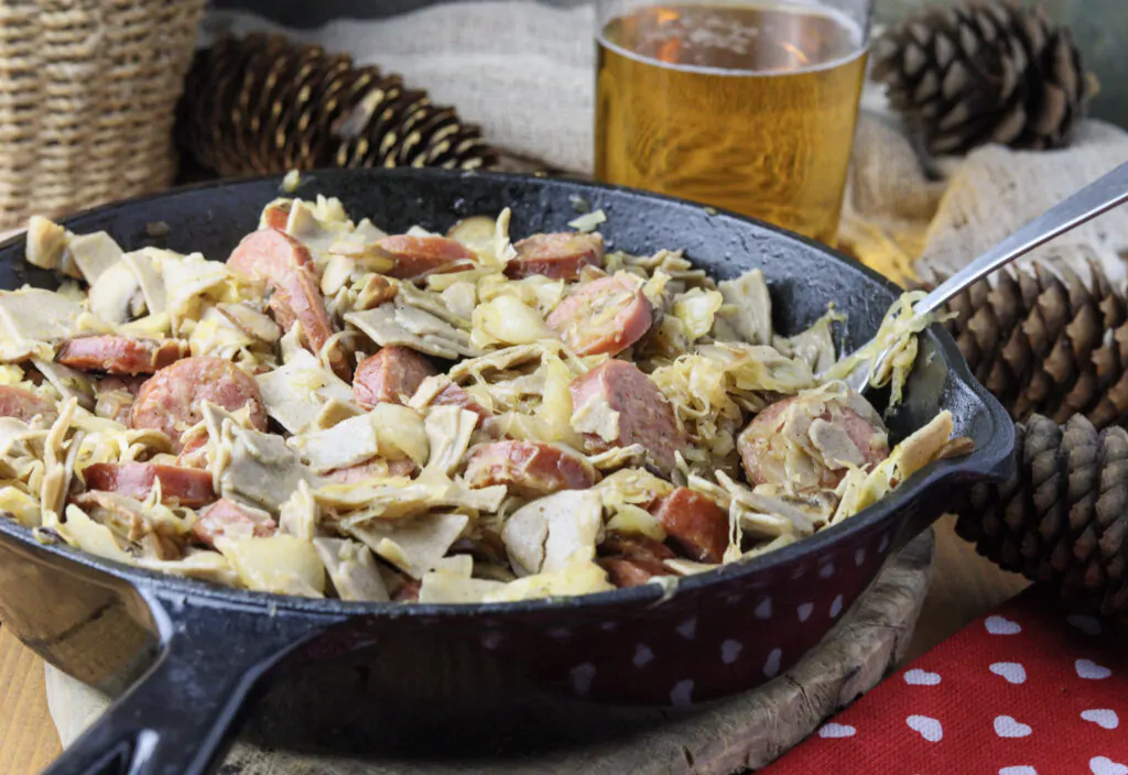 Łazanki noodles with sauerkraut, cabbage, smoked sausage, bacon and mushrooms