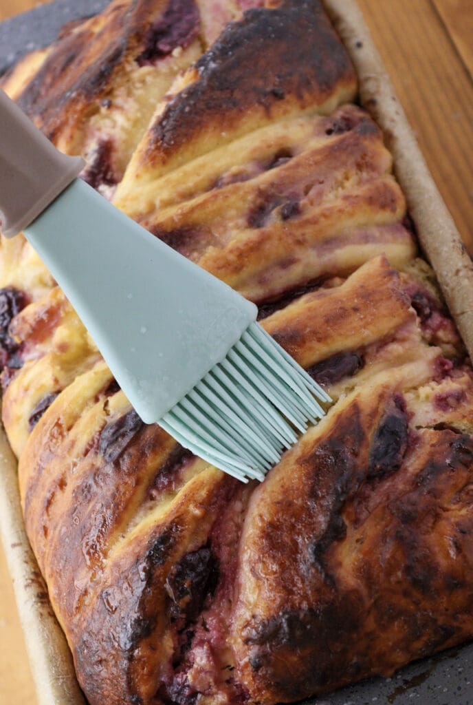 image showing how to glaze the babka with sugar wash