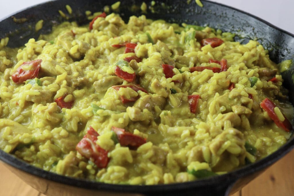 Image of one pot chicken curry and rice cooked and served fresh and hot. 