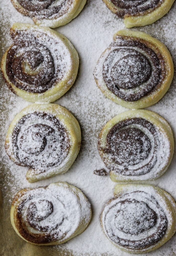 puff pastry cinnamon pinwheels served on a plate