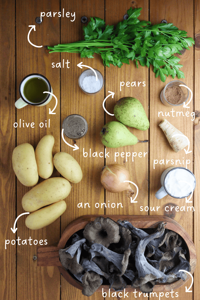 gathering ingredients for pear potato soup with black trumpets: pears, potatoes, parsnip, black trumpets, parsley, sour cream, onion, salt, black pepper, nutmeg and olive oil 