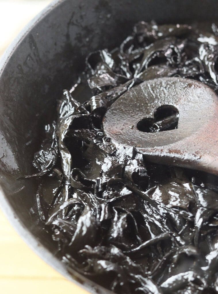 image showing how to stir-fry the black trumpet mushrooms before adding them to the soup