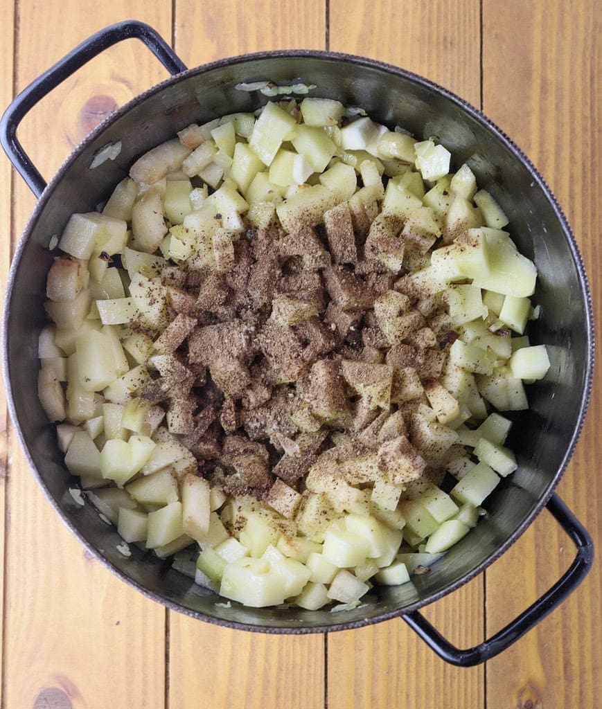 image showing how to add potatoes, pear and spices 