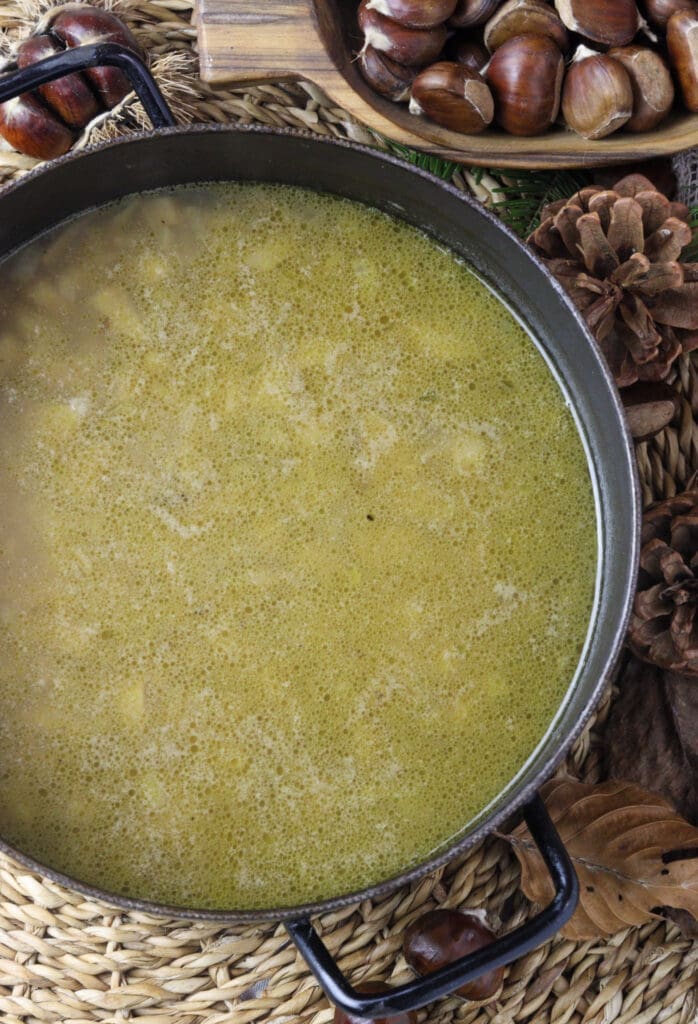 image showing how to add vegetable broth to the soup 