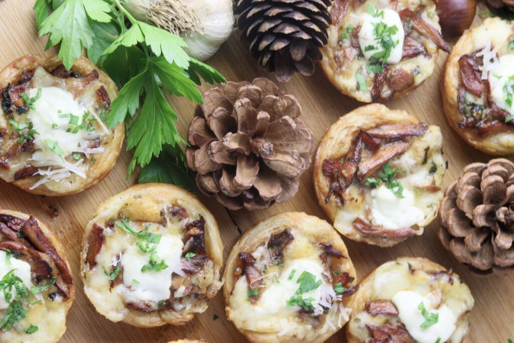 baked and served lactarius deliciosus ceesy puff pastry tartlets 