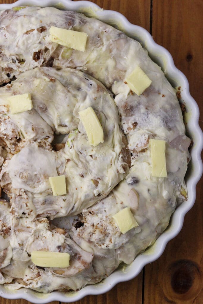 image showing how to add butter on top of strudel before baking