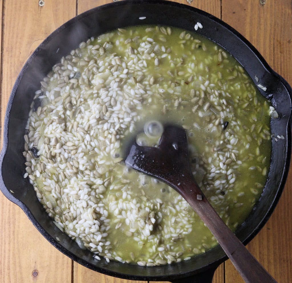 image showing how to add vegetable stock to the pan