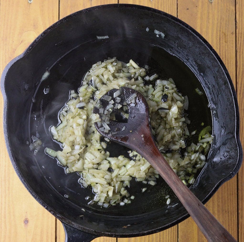 image showing how to stir-fry onions before adding rice to the pan