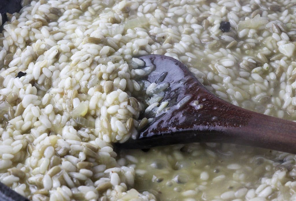 image showing how to cook the risotto by frequent stirring