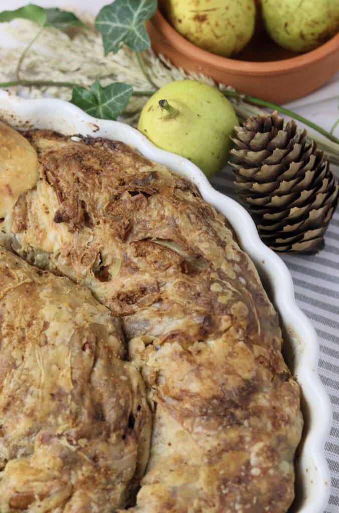 pear cheese strudel with raisins with fresh pears in the background