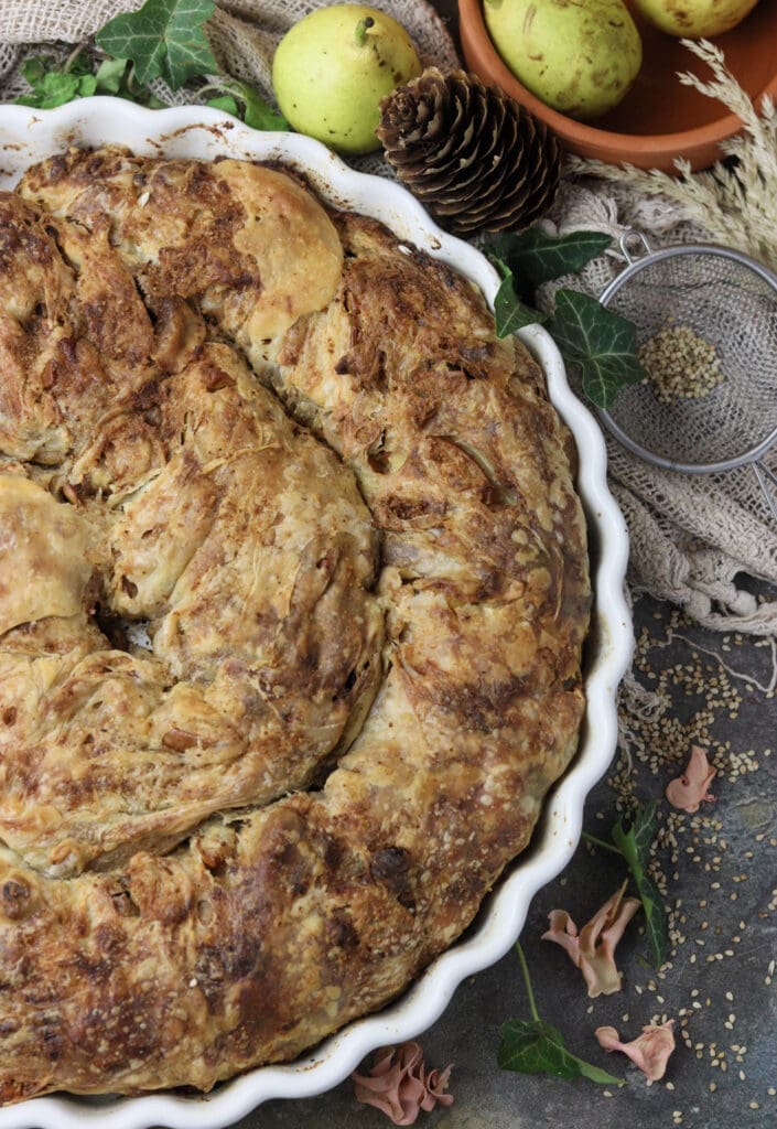 image showing a pan full of pear cheese strudel with raisins