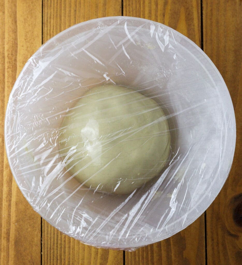 image showing how to rest the dough covered with plastic foil