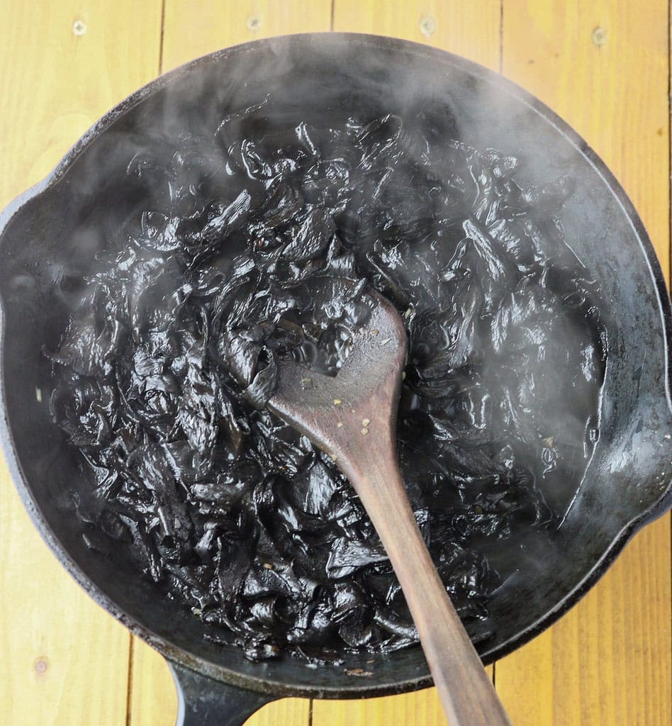 image showing how to stir-fry black trumpets in a pan