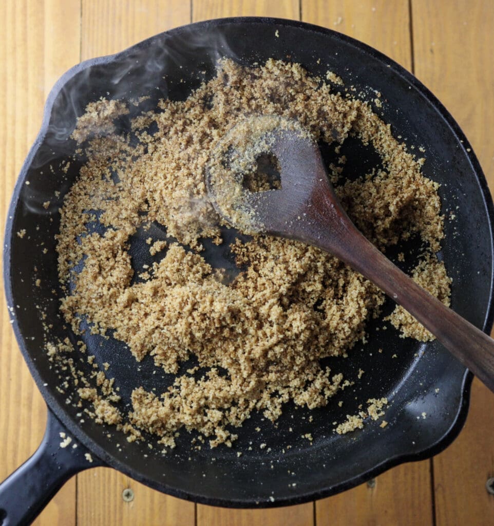 image showing how to toast the bread crumbs in a frying pan