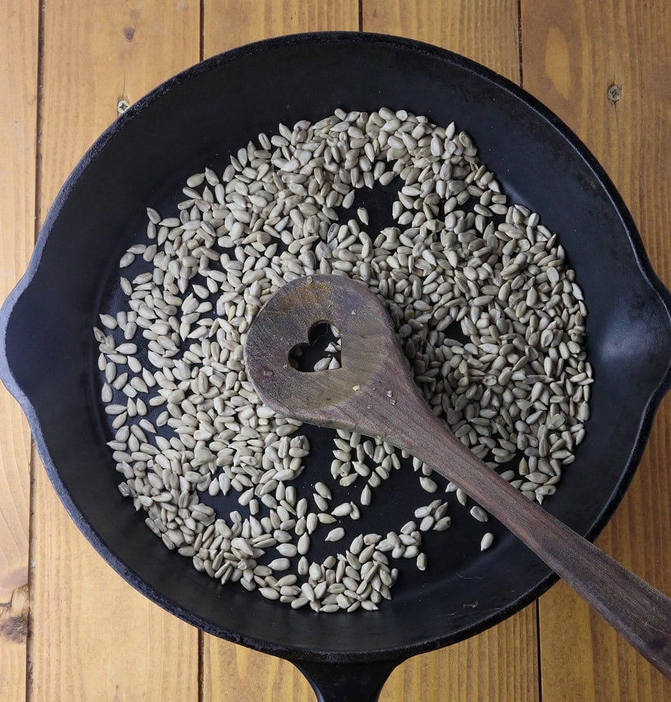 image showing how to toast sunflower seeds before adding to risotto