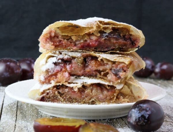 Plum strudel rolls stacked on top of eachoter