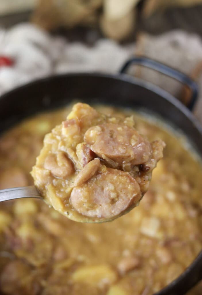 A full ladle of delicious, homemade jota soup with sauerkraut, potates, beans and carniolan sausage.