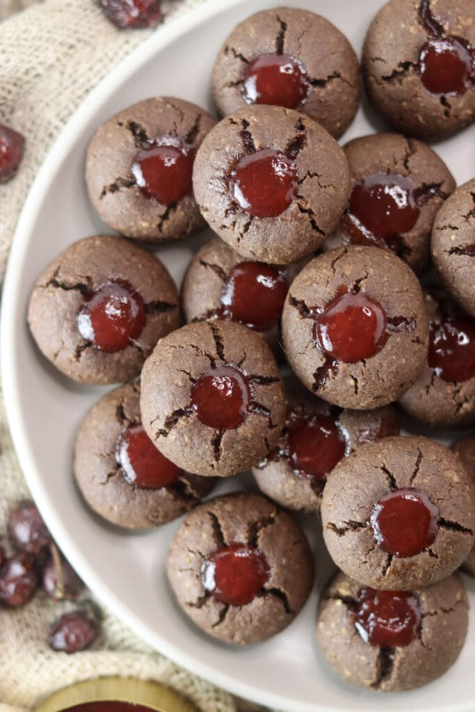 A close shot of delicious jam filled buckwheat cookies on a plate