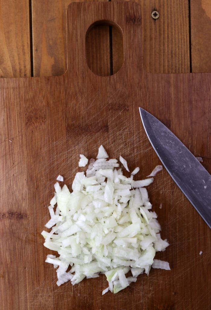 How to thinly chop the onions before adding them to the filling mixture.