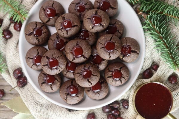 Delicious gluten free buckwheat cookies filled with jam and served on a plate