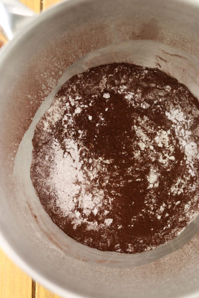 A bowl of sifted buckwheat flour with cocoa and baking powder.