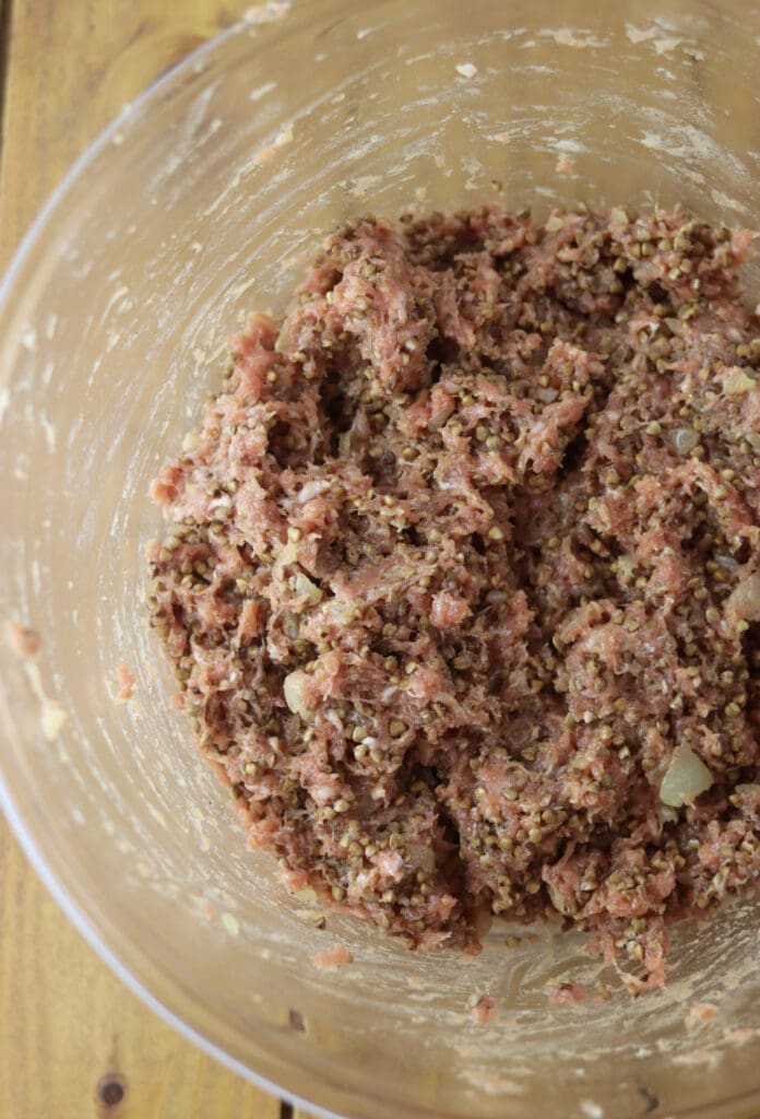 Buckwheat stuffing in a bowl, carefully mixed together with added one cup of water.