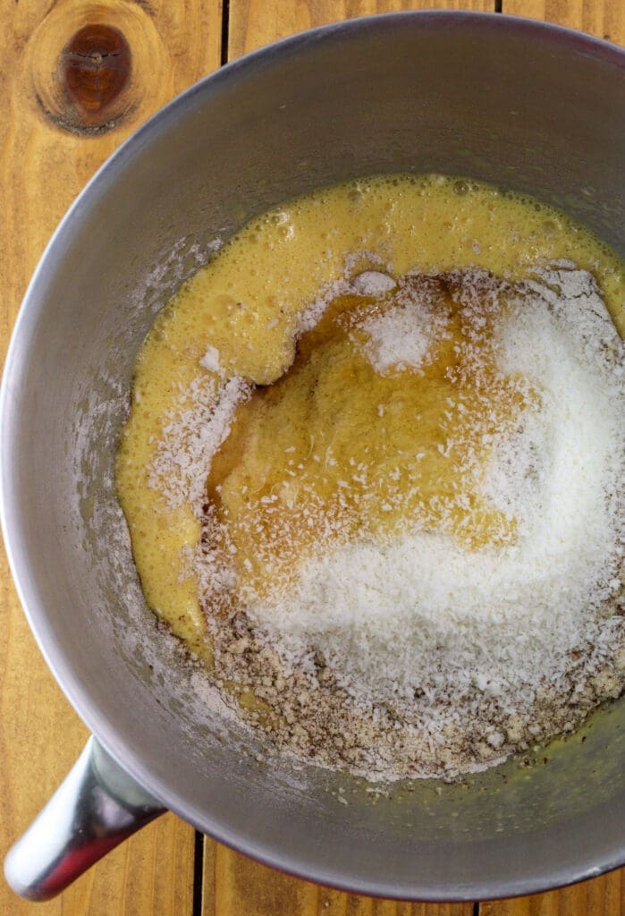 adding dry ingredients like coconut flour, buckwheat flour and cinnamon to dry ingredients when making the cake batter