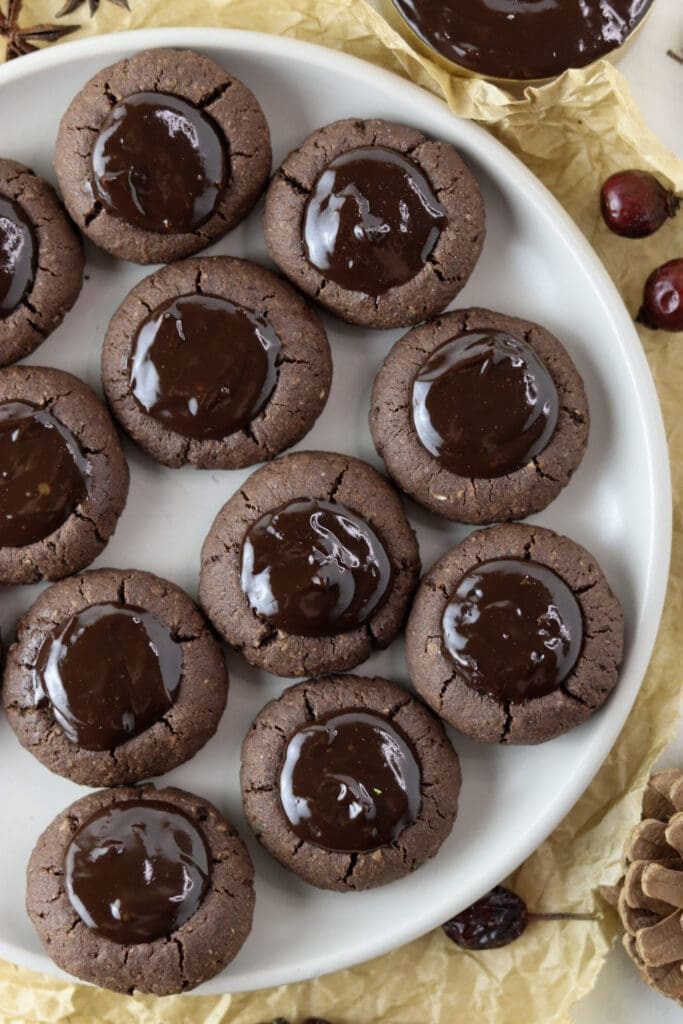 Buckwheat chocolate thumbprint cookies on a plate.