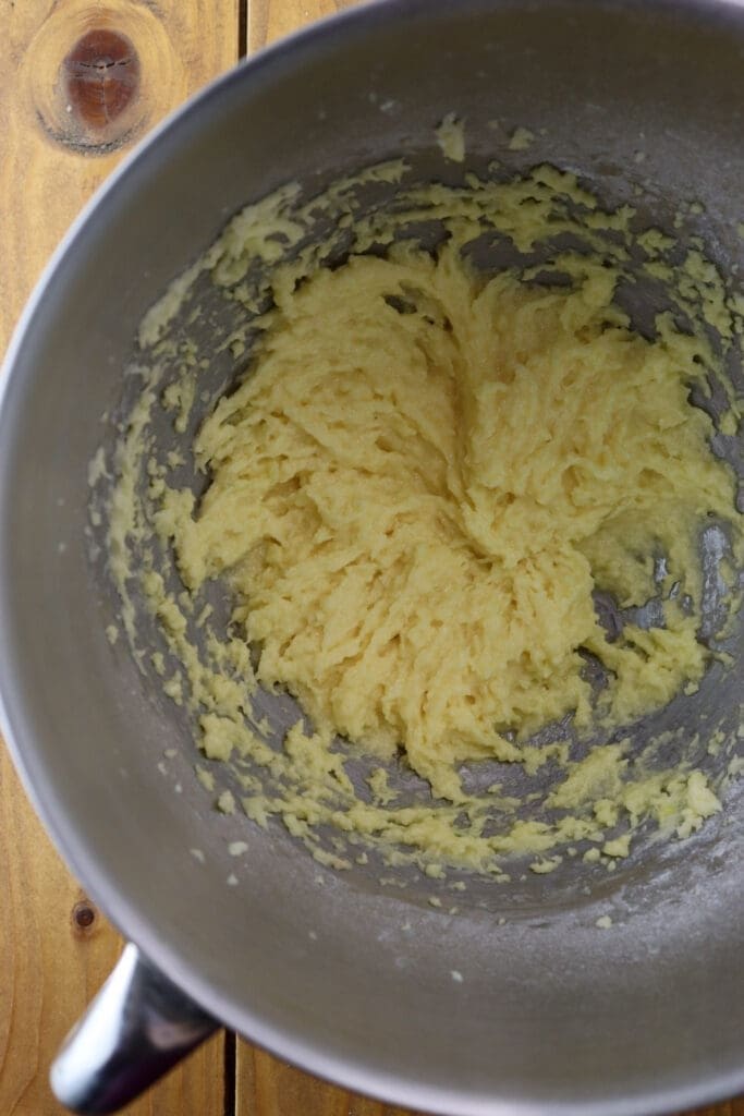 How to mix the sugar with the butter and then adding one egg to the mixture