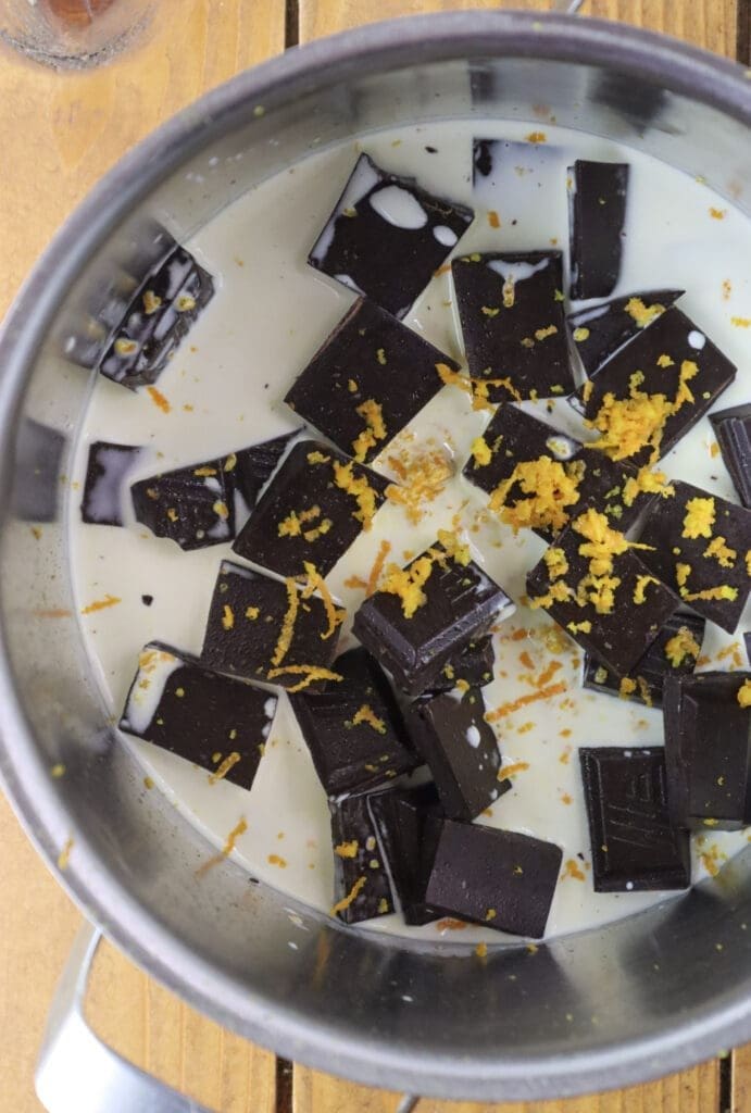 How to make the filling with chocolate, heavy cream and fresh orange zest.