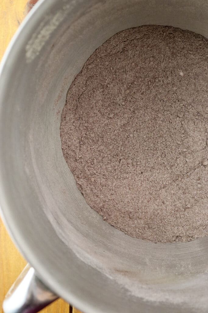 Mixing dry ingredients for the cookie dough: bucwheat flour, hazelnuts, baking powder and a pinch of salt.