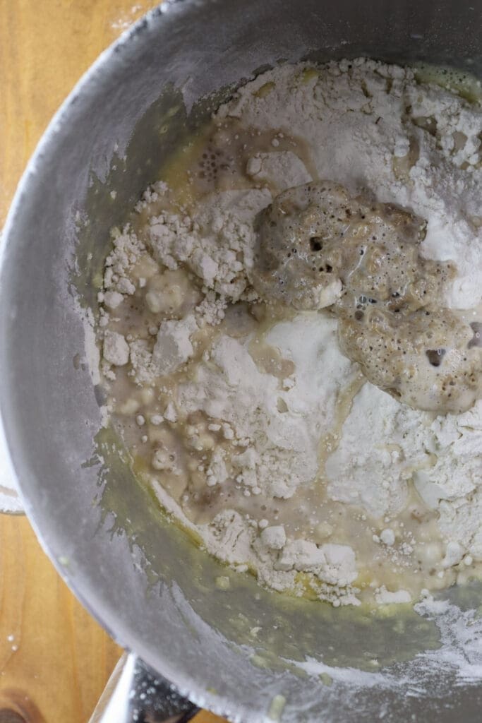 How to mix together the ingredients for the dough - flour, warm milk, yeast and a pinch of salt